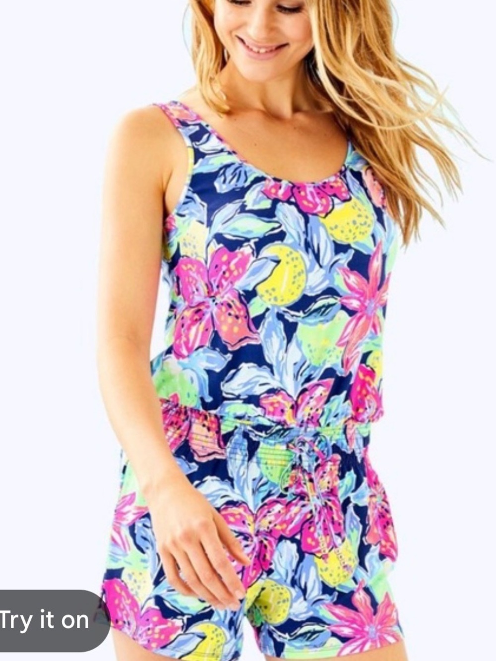 This Lilly Pulitzer Tala Romper features a vibrant "Nauti Navy Capri Soleil"
